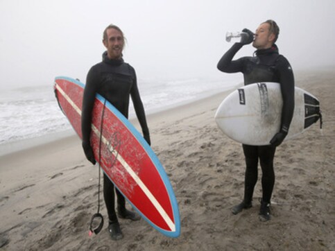 Warm Christmas weather brings surfers to New York waters Warm Christmas weather brings surfers to New York waters