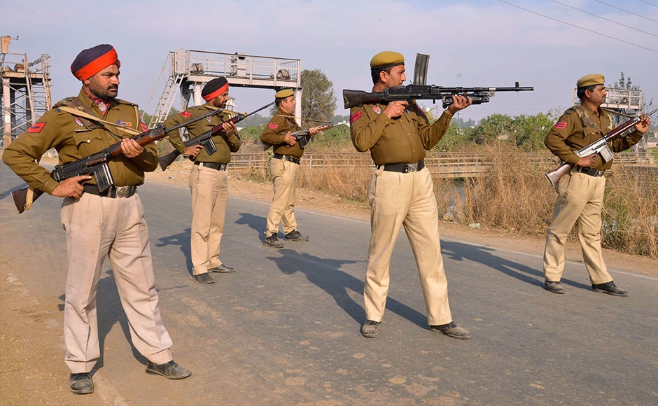 Police personnel stand alert outside the Air Force base on 2 January. The attack comes shortly after Prime Minister Narendra Modi's surprise visit to Pakistan. AFP Police personnel stand alert outside the Air Force base on 2 January. The attack comes shortly after Prime Minister Narendra Modi's surprise visit to Pakistan. AFP
