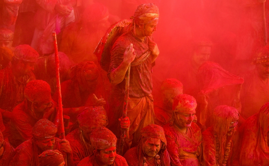Lathmar Holi celebrations were in full swing last week at a temple in Nandgaon in Uttar Pradesh. Here we see revelers covered in gulal (powdered colour) at the temple. AFP Lathmar Holi celebrations were in full swing last week at a temple in Nandgaon in Uttar Pradesh. Here we see revelers covered in gulal (powdered colour) at the temple. AFP