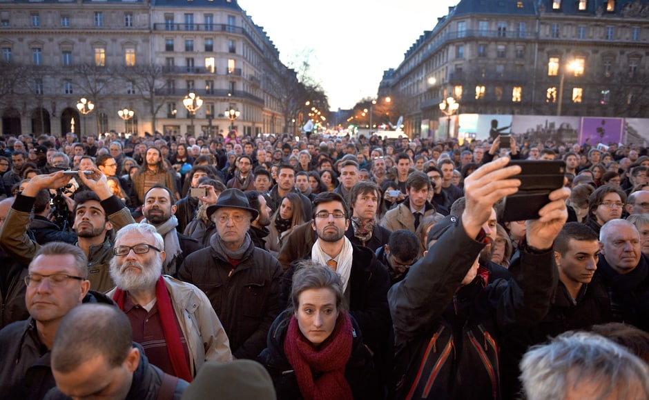 People gather in front of the Hotel de Ville in Paris as a tribute to the victims of Brussels following triple bomb attacks. AFP People gather in front of the Hotel de Ville in Paris as a tribute to the victims of Brussels following triple bomb attacks. AFP