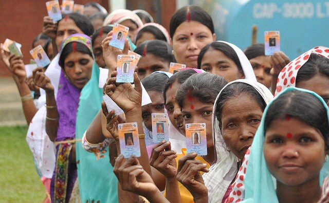 Voters wait in queues to cast their vote during first phase of Assam Assembly election, in Amguri in Sivasagar district of Assam on Monday. The voter turnout in the state was around 70 percent. PTI Photo Voters wait in queues to cast their vote during first phase of Assam Assembly election, in Amguri in Sivasagar district of Assam on Monday. The voter turnout in the state was around 70 percent. PTI Photo