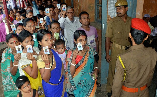 Voters stand in queue at a polling booth to cast their vote in Silchar. The issue of Bangladeshi immigrants entering Assam is overshadowing all other issues in several constituencies in the state. PTI Voters stand in queue at a polling booth to cast their vote in Silchar. The issue of Bangladeshi immigrants entering Assam is overshadowing all other issues in several constituencies in the state. PTI