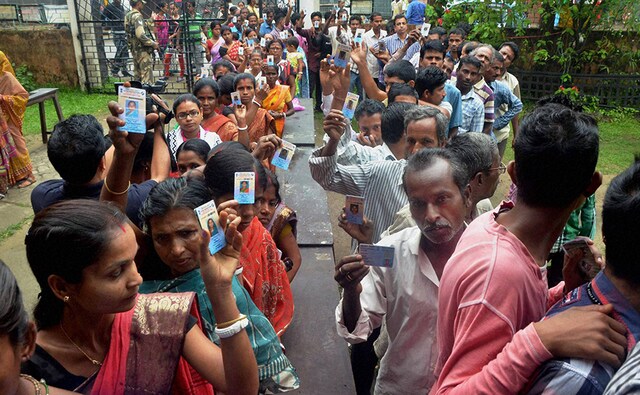 Voters stand in queue at a polling booth in Silchar. Silchar, along with Karimganj North and Karimganj South, has a close political association with the adjoining Left-ruled Tripura. The BJP has renominated for the Silchar constituency sitting legislator Dilip Kumar Paul who bagged the seat in 2014 by elections. PTI Voters stand in queue at a polling booth in Silchar. Silchar, along with Karimganj North and Karimganj South, has a close political association with the adjoining Left-ruled Tripura. The BJP has renominated for the Silchar constituency sitting legislator Dilip Kumar Paul who bagged the seat in 2014 by elections. PTI