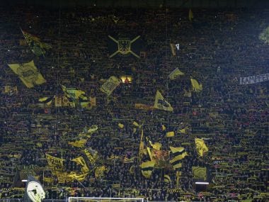 Dortmund fans wave their flags. AFP