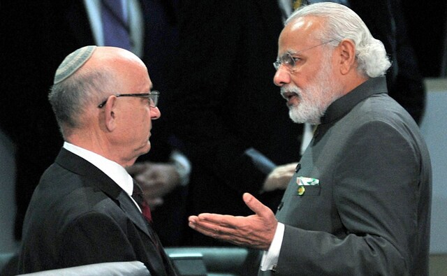PM Modi interacting with the leaders at the opening plenary of the summit. PTI PM Modi interacting with the leaders at the opening plenary of the summit. PTI