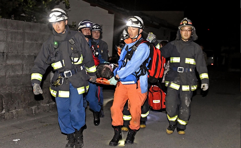 Firefighters carry an injured person after the earthquake in Mashiki, southern Japan. The country's Chief Cabinet Secretary Yoshihide Suga told a news conference that damage was being assessed, but there were no abnormalities at nearby nuclear facilities. AP Firefighters carry an injured person after the earthquake in Mashiki, southern Japan. The country's Chief Cabinet Secretary Yoshihide Suga told a news conference that damage was being assessed, but there were no abnormalities at nearby nuclear facilities. AP
