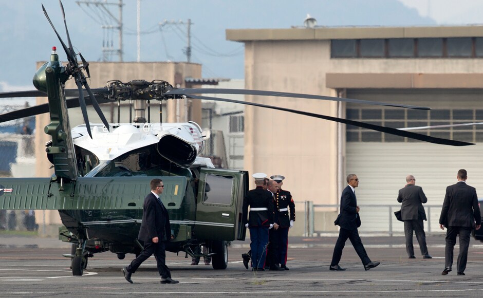 US President Barack Obama on Friday became the first American president to confront the historic and haunted ground of Hiroshima. Obama, third from right, walks off Marine One at the landing zone in Hiroshima on Friday. AP US President Barack Obama on Friday became the first American president to confront the historic and haunted ground of Hiroshima. Obama, third from right, walks off Marine One at the landing zone in Hiroshima on Friday. AP