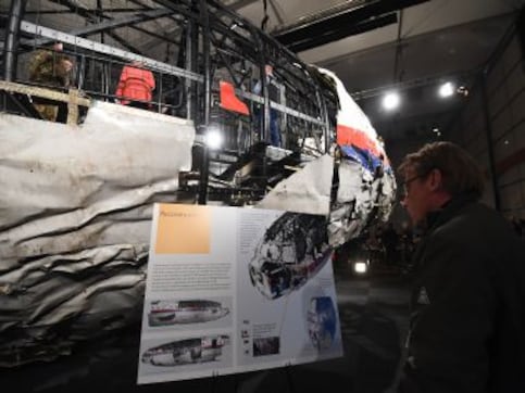 Crew members' families sue Malaysia Airlines over downing of MH17 Crew members' families sue Malaysia Airlines over downing of MH17