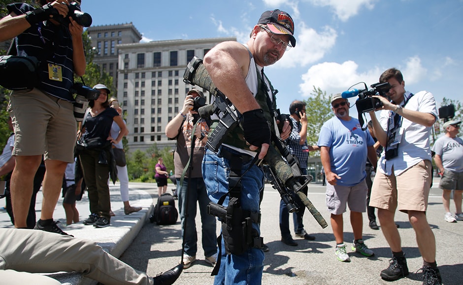 Steve Thacker carrying a rifle and a handgun is surrounded by news media in a public square in Cleveland. Ohio is an open-carry state and allows anyone above the age of 21 who has a licence to carry their firearm openly. The head of Cleveland's police union wrote to Governor John Kasich asking him to suspend the open-carry law for the duration of the RNC. However, Kasich rejected the request, saying that he does not have the power to do so. Reuters Steve Thacker carrying a rifle and a handgun is surrounded by news media in a public square in Cleveland. Ohio is an open-carry state and allows anyone above the age of 21 who has a licence to carry their firearm openly. The head of Cleveland's police union wrote to Governor John Kasich asking him to suspend the open-carry law for the duration of the RNC. However, Kasich rejected the request, saying that he does not have the power to do so. Reuters