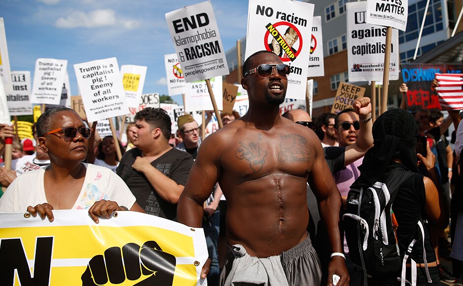 Demonstrators hold placards during a march by various groups, including 'Black Lives Matter' and 'Shut Down Trump and the RNC' ahead of the convention. Trump had earlier said that Black Lives Matter is dividing America. Reuters Demonstrators hold placards during a march by various groups, including 'Black Lives Matter' and 'Shut Down Trump and the RNC' ahead of the convention. Trump had earlier said that Black Lives Matter is dividing America. Reuters