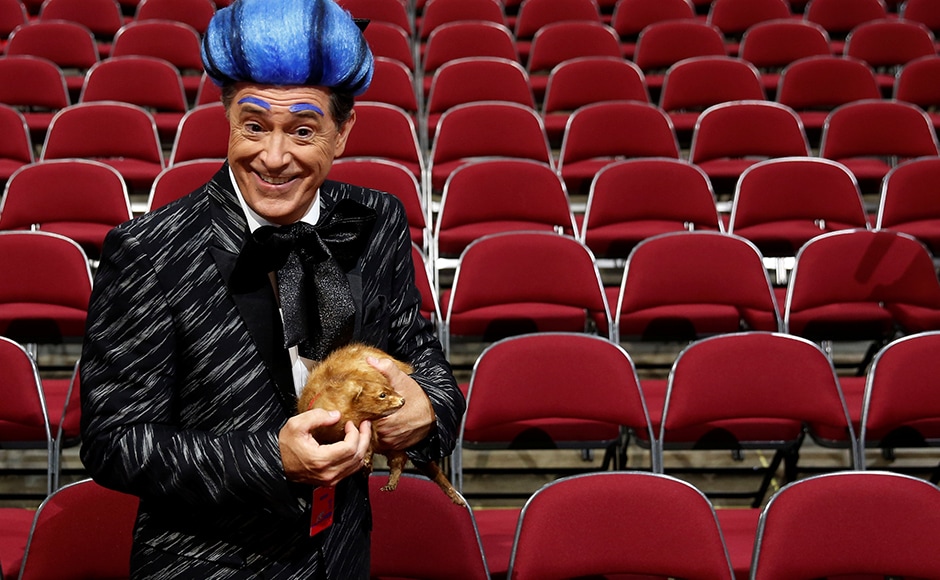 CBS television comedian Stephen Colbert films comedy bits with his crew on the floor of the RNC. He also snuck up to the stage dressed like the emcee from 'Hunger Games' and delivered a scathing attack on Trump before he was made to leave. Reuters CBS television comedian Stephen Colbert films comedy bits with his crew on the floor of the RNC. He also snuck up to the stage dressed like the emcee from 'Hunger Games' and delivered a scathing attack on Trump before he was made to leave. Reuters