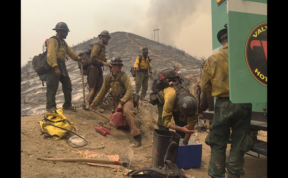 USDA Forest Service firefighters with the Valyermo Hotshots of Angeles National Forest prepare to head out again on Little Tujunga Canyon Road near the Wildlife Waystation in Santa Clarita, California.AP USDA Forest Service firefighters with the Valyermo Hotshots of Angeles National Forest prepare to head out again on Little Tujunga Canyon Road near the Wildlife Waystation in Santa Clarita, California.AP