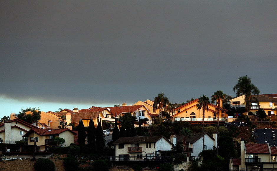 Smoke from a nearby wildfire is viewed from Monterey Park, California. Smoke drifted over downtown Los Angeles, about 30 miles from the fire's location in Santa Clarita. It's one of several blazes burning in Southern California as the region swelters under triple-digit heat. AP Smoke from a nearby wildfire is viewed from Monterey Park, California. Smoke drifted over downtown Los Angeles, about 30 miles from the fire's location in Santa Clarita. It's one of several blazes burning in Southern California as the region swelters under triple-digit heat. AP