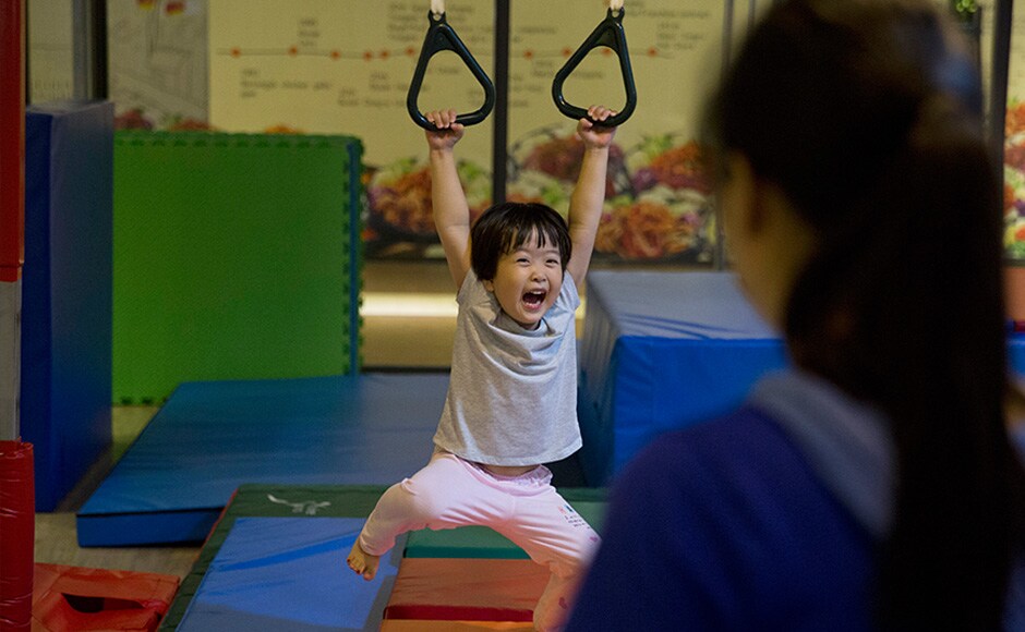 A child enjoys swinging on still rings during classes at the Inspire Sports private gym in Shanghai, China. The scene of giggling children having fun and attempting somersaults or gingerly walking on low balance beam is a rare sight in China where gym lessons usually evokes stereotypical images of tearful children practicing splits. However Chinese sports officials believe this sort of spontaneous interest in the sport is a welcome step to fundamentally change China's current elite sports system. AP A child enjoys swinging on still rings during classes at the Inspire Sports private gym in Shanghai, China. The scene of giggling children having fun and attempting somersaults or gingerly walking on low balance beam is a rare sight in China where gym lessons usually evokes stereotypical images of tearful children practicing splits. However Chinese sports officials believe this sort of spontaneous interest in the sport is a welcome step to fundamentally change China's current elite sports system. AP