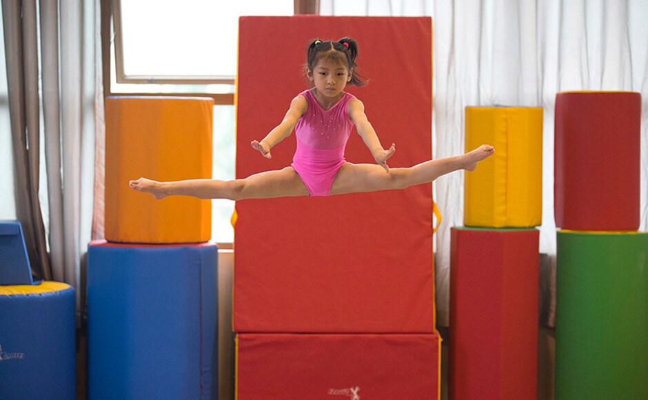 A young gymnast trains at the Xuhui Sports School in Shanghai, China. There are strong efforts to reform the state-led system, which is struggling to recruit the next generation of stars despite its glorious records of churning out hundreds of Olympic gold medalists and world champions. AP A young gymnast trains at the Xuhui Sports School in Shanghai, China. There are strong efforts to reform the state-led system, which is struggling to recruit the next generation of stars despite its glorious records of churning out hundreds of Olympic gold medalists and world champions. AP