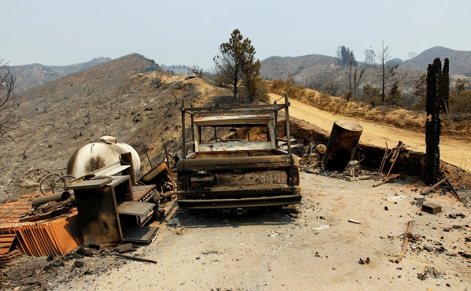 A burned out vehicle is seen at the site of a destroyed house. Big Sur establishments were already reporting as much as a 50 percent drop in business, said Stan Russell, executive director of the chamber of commerce. That's even though the only signs of the blaze were fire trucks and an occasional whiff of smoke along the famously winding and scenic Highway 1. Normally, this time of year "is when everybody really runs at 100 percent," Russell said Friday about tourism in the area. "This is when we make our money." Reuters A burned out vehicle is seen at the site of a destroyed house. Big Sur establishments were already reporting as much as a 50 percent drop in business, said Stan Russell, executive director of the chamber of commerce. That's even though the only signs of the blaze were fire trucks and an occasional whiff of smoke along the famously winding and scenic Highway 1. Normally, this time of year "is when everybody really runs at 100 percent," Russell said Friday about tourism in the area. "This is when we make our money." Reuters