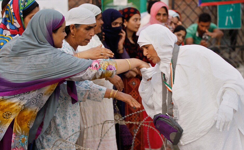 A Kashmiri Muslim pilgrim, right, is greeted by relatives and neighbours as she leaves for the annual hajj pilgrimage to the holy city of Mecca, in Srinagar on Wednesday. The hajj pilgrimage, which is among the five pillars of Islam, attracts around three million Muslims worldwide each year. AP A Kashmiri Muslim pilgrim, right, is greeted by relatives and neighbours as she leaves for the annual hajj pilgrimage to the holy city of Mecca, in Srinagar on Wednesday. The hajj pilgrimage, which is among the five pillars of Islam, attracts around three million Muslims worldwide each year. AP