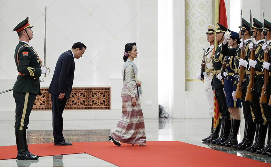 China's Premier Li Keqiang and Myanmar State Counselor Aung San Suu Kyi (3rd L) attend a welcoming ceremony at the Great Hall of the People in Beijing, China on 18 August 18. Reuters China's Premier Li Keqiang and Myanmar State Counselor Aung San Suu Kyi (3rd L) attend a welcoming ceremony at the Great Hall of the People in Beijing, China on 18 August 18. Reuters