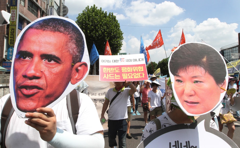 South Korean protesters wearing masks of US President Barack Obama and South Korean President Park Geun-hye, march to oppose a plan to deploy an advanced US missile defense system called Terminal High-Altitude Area Defense, or THAAD, in Seoul, South Korea, Monday, 15 August, 2016. AP South Korean protesters wearing masks of US President Barack Obama and South Korean President Park Geun-hye, march to oppose a plan to deploy an advanced US missile defense system called Terminal High-Altitude Area Defense, or THAAD, in Seoul, South Korea, Monday, 15 August, 2016. AP