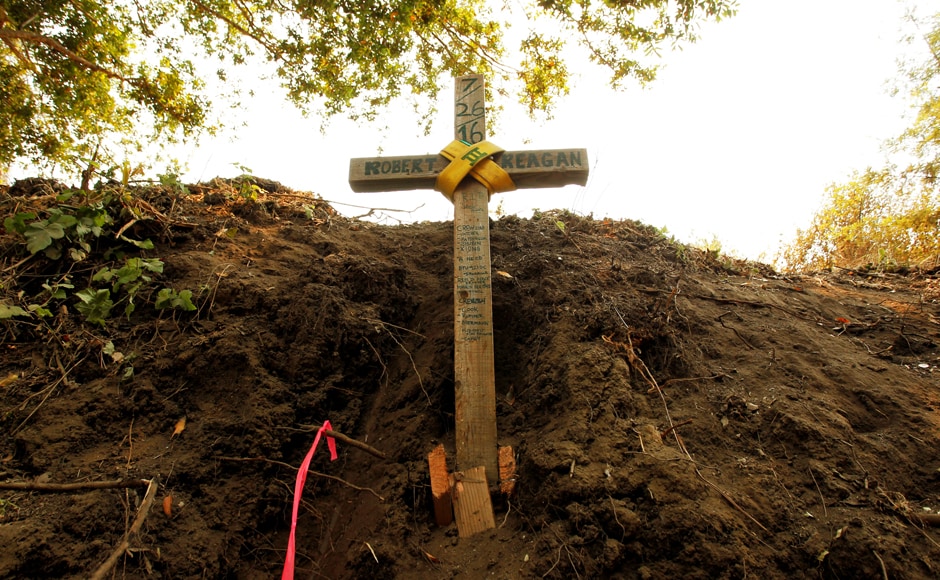 A cross is seen at the site where bulldozer operator Robert Reagan of Fresno County was killed in a rollover on 26 July, while fighting the Soberanes Fire. His sister Hannah Cunnings said that Reagan was the kind of person who would offer to put snow chains on your car or fix an engine that needed fixing. "Even since he was a boy he just really wanted to help people," she said, crying. The Monterey County Sheriff's Office said Reagan is survived by a common-law wife and two young daughters. Cunnings said her brother and his wife also cared for a young niece. Reuters A cross is seen at the site where bulldozer operator Robert Reagan of Fresno County was killed in a rollover on 26 July, while fighting the Soberanes Fire. His sister Hannah Cunnings said that Reagan was the kind of person who would offer to put snow chains on your car or fix an engine that needed fixing. "Even since he was a boy he just really wanted to help people," she said, crying. The Monterey County Sheriff's Office said Reagan is survived by a common-law wife and two young daughters. Cunnings said her brother and his wife also cared for a young niece. Reuters