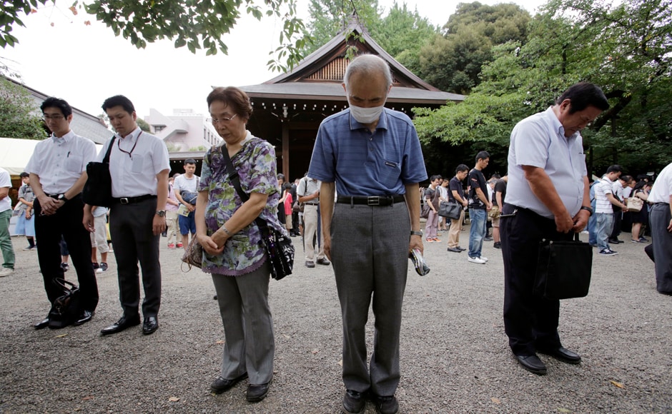 Visitors offer a silent prayer to the ward dead at Yasukuni Shrine in Tokyo Monday, Aug. 15, 2016. Japan marked the 71st anniversary of the end of World War II. APThousands of people, including ageing survivors and relatives of victims, observed a minute's silence at 11.02 am, the exact moment of the blast. Photo: AP Visitors offer a silent prayer to the ward dead at Yasukuni Shrine in Tokyo Monday, Aug. 15, 2016. Japan marked the 71st anniversary of the end of World War II. APThousands of people, including ageing survivors and relatives of victims, observed a minute's silence at 11.02 am, the exact moment of the blast. Photo: AP