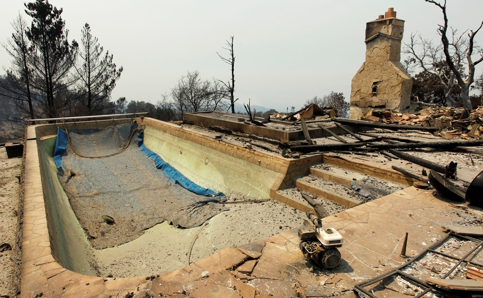 A swimming pool and a chimney remain at the site of a destroyed house. The ferocious blaze destroyed much of Sable Ranch in Santa Clarita, which has Western-style buildings used for movie locations. The ranch has been the site of various television and film shoots, including 24, The A-Team, Robin Hood: Men in Tights, and Maverick. Reuters A swimming pool and a chimney remain at the site of a destroyed house. The ferocious blaze destroyed much of Sable Ranch in Santa Clarita, which has Western-style buildings used for movie locations. The ranch has been the site of various television and film shoots, including 24, The A-Team, Robin Hood: Men in Tights, and Maverick. Reuters