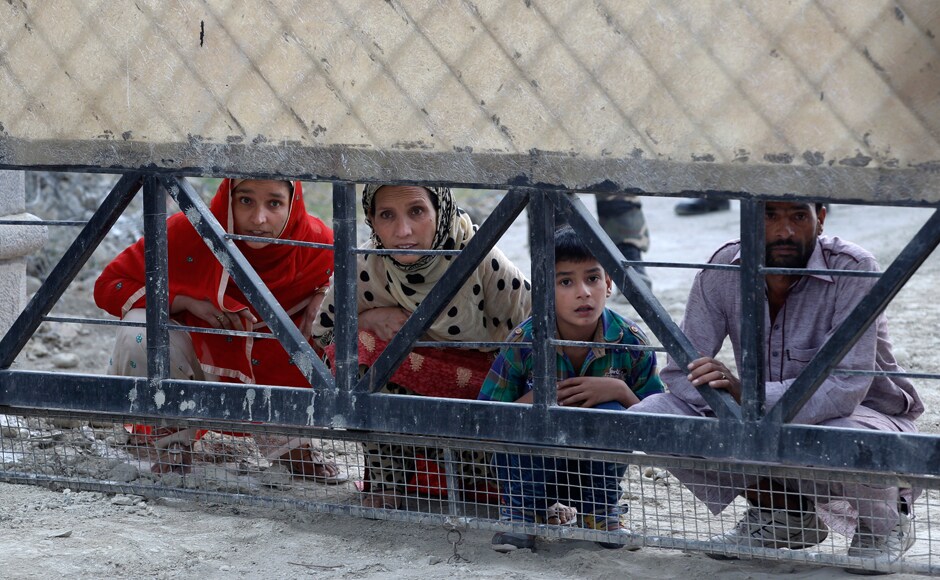 Family members of a Kashmiri Muslim pilgrim wait outside the closed gate of a hajj house as they wait to send him off for the annual hajj pilgrimage to Mecca. AP Family members of a Kashmiri Muslim pilgrim wait outside the closed gate of a hajj house as they wait to send him off for the annual hajj pilgrimage to Mecca. AP