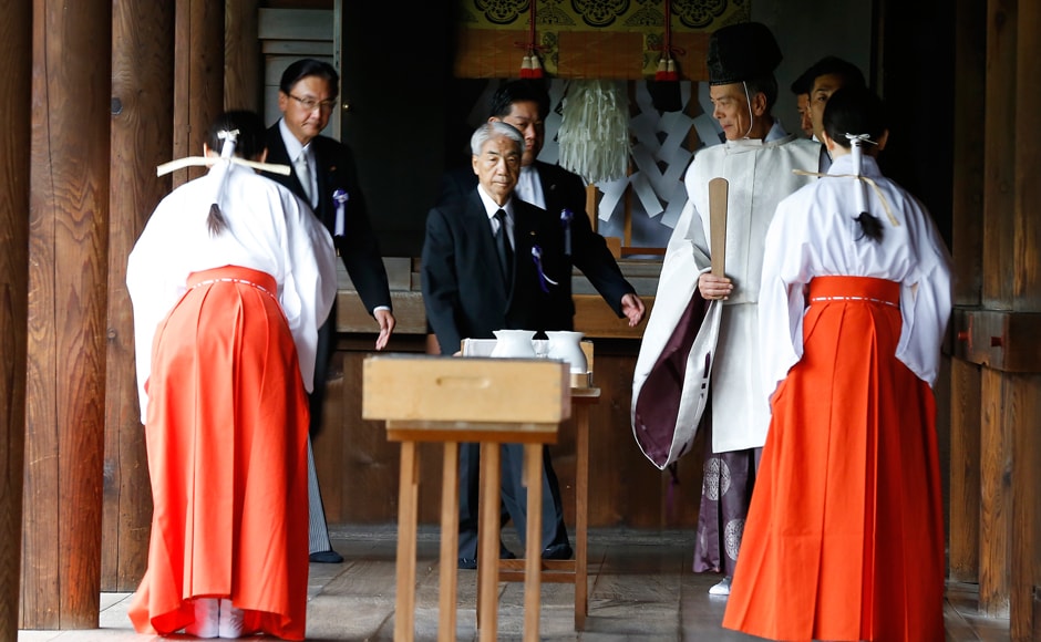 Even as people offered prayers to the dead, Japanese Prime Minister Shinzo Abe avoided going to the shrine. He sent a ritual donation of money and religious ornaments instead. Photo: AP Even as people offered prayers to the dead, Japanese Prime Minister Shinzo Abe avoided going to the shrine. He sent a ritual donation of money and religious ornaments instead. Photo: AP
