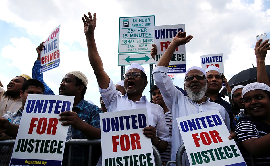 Muslim representatives shout slogans as they gather for the funeral service of the Imam. The police on Monday arrested Oscar Morel, a local from the neighbouring borough of Brooklyn, for the murder of the Imam and one of his associate. Reuters Muslim representatives shout slogans as they gather for the funeral service of the Imam. The police on Monday arrested Oscar Morel, a local from the neighbouring borough of Brooklyn, for the murder of the Imam and one of his associate. Reuters