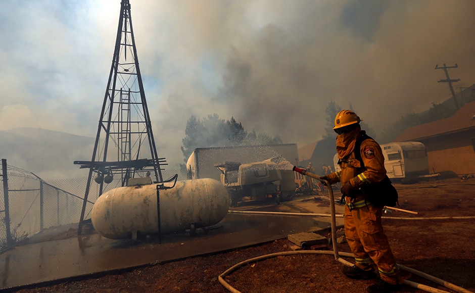 Firefighters had carved containment lines around only four percent of the blaze by Wednesday night, fire officials said. Reuters Firefighters had carved containment lines around only four percent of the blaze by Wednesday night, fire officials said. Reuters