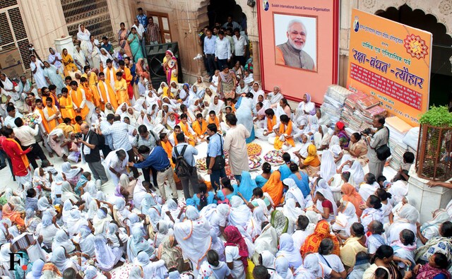 It was a new dawn for hundreds of so-called "untouchable women" who defied age-old tradition to take part in Rakhshabandhan ceremony in the temple town with great enthusiasm and fervour. This initiative was taken by Sulabh International's mentor Bindeshwar Pathak who is campaigning for social equality for four decades. (Naresh Sharma/Firstpost) It was a new dawn for hundreds of so-called "untouchable women" who defied age-old tradition to take part in Rakhshabandhan ceremony in the temple town with great enthusiasm and fervour. This initiative was taken by Sulabh International's mentor Bindeshwar Pathak who is campaigning for social equality for four decades. (Naresh Sharma/Firstpost)