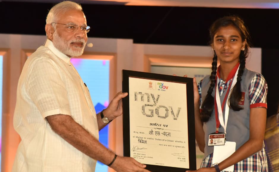 Before taking up the citizens' questions, Modi felicitated the winners of the MyGov contest. Photo: PIB Before taking up the citizens' questions, Modi felicitated the winners of the MyGov contest. Photo: PIB