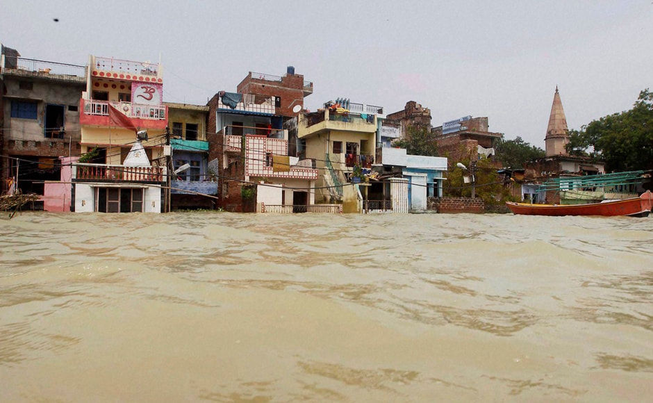 Many houses in Allahabad where water had entered due to the floods have been turned into swamps with mud inside their homes. PTI Many houses in Allahabad where water had entered due to the floods have been turned into swamps with mud inside their homes. PTI