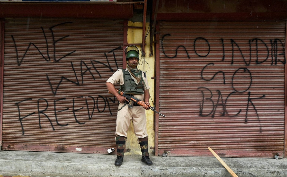 Srinagar: As curfew enters its 50th day in Kashmir, a CRPF personnel stands on guard amidst chants of 'Azadi' ringing through out the valley . PTI Srinagar: As curfew enters its 50th day in Kashmir, a CRPF personnel stands on guard amidst chants of 'Azadi' ringing through out the valley . PTI