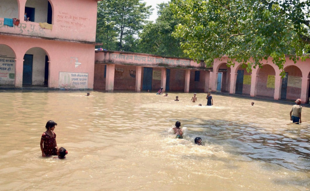 In East Champaran, children play at a school flooded by Gandak river at Ijra village in East Champaran district of Bihar on Tuesday. The flood situation in Bihar remains grim as 60 flood related deaths have been reported so far from the northern Indian state. PTI In East Champaran, children play at a school flooded by Gandak river at Ijra village in East Champaran district of Bihar on Tuesday. The flood situation in Bihar remains grim as 60 flood related deaths have been reported so far from the northern Indian state. PTI