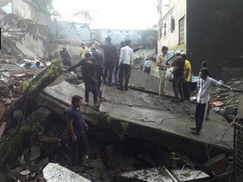Bhiwandi building collapse: Two killed, four rescued, many trapped under debris Bhiwandi building collapse: Two killed, four rescued, many trapped under debris