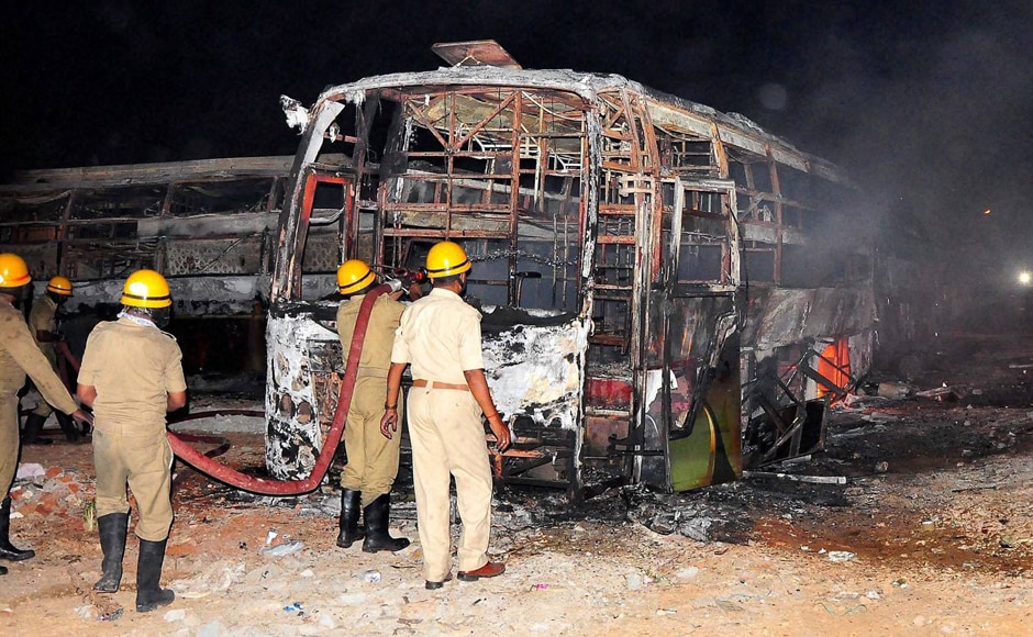 Fire fighters trying to douse a fire in Tamil Nadu-bound buses. Managing Director of Salem headquartered KPN Tours and Travels Limited Rajesh Natarajan claimed that 40 of his buses were set on fire. (Photo: PTI) Fire fighters trying to douse a fire in Tamil Nadu-bound buses. Managing Director of Salem headquartered KPN Tours and Travels Limited Rajesh Natarajan claimed that 40 of his buses were set on fire. (Photo: PTI)
