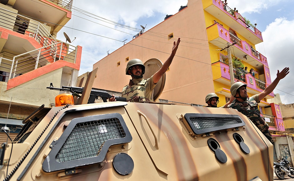 Curfew was relaxed since Tuesday morning for Muslims to offer Eid prayers at mosques and Idgah maidan in 16 sensitive localities where it was imposed on Monday night after violence and arson rocked the city over reported attacks on Kannadigas and their property in Chennai on Monday. (Photo: AP) Curfew was relaxed since Tuesday morning for Muslims to offer Eid prayers at mosques and Idgah maidan in 16 sensitive localities where it was imposed on Monday night after violence and arson rocked the city over reported attacks on Kannadigas and their property in Chennai on Monday. (Photo: AP)