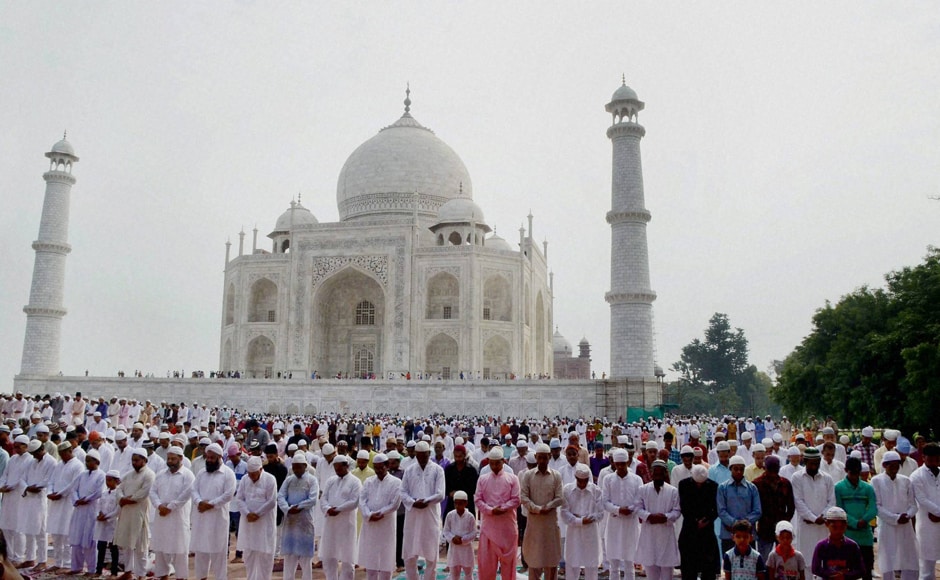 Eid al-Adha was celebrated across India, except in Kashmir and Bengaluru, the cities mired by protests, stone-pelting, burning of vehicles and curfew. Devotees offer Eid prayers in Taj Mahal, Agra on Tuesday. (Photo: PTI) Eid al-Adha was celebrated across India, except in Kashmir and Bengaluru, the cities mired by protests, stone-pelting, burning of vehicles and curfew. Devotees offer Eid prayers in Taj Mahal, Agra on Tuesday. (Photo: PTI)