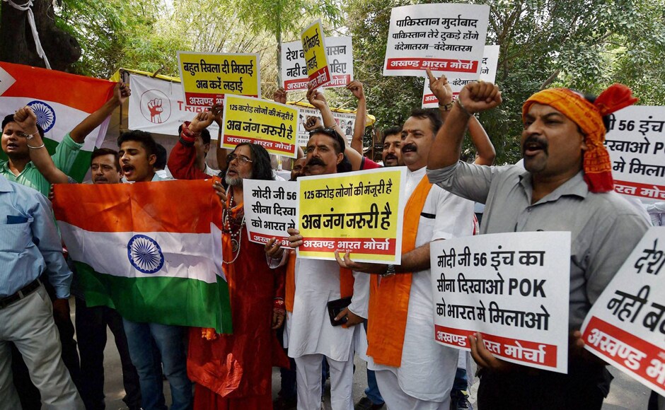 Seventeen soldiers and four militants were killed after heavily armed militants stormed a battalion headquarters of the Army in North Kashmir's Uri town. Activists of Akhand Bharat Morcha protested against the attack in New Delhi. Photo: PTI Seventeen soldiers and four militants were killed after heavily armed militants stormed a battalion headquarters of the Army in North Kashmir's Uri town. Activists of Akhand Bharat Morcha protested against the attack in New Delhi. Photo: PTI