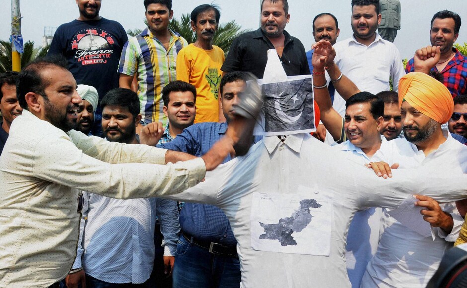 While Congress targeted PM Modi for the attacks, some party workers protested against the attack in Amritsar by slapping their shoes on the Pakistan flags. While Congress targeted PM Modi for the attacks, some party workers protested against the attack in Amritsar by slapping their shoes on the Pakistan flags.