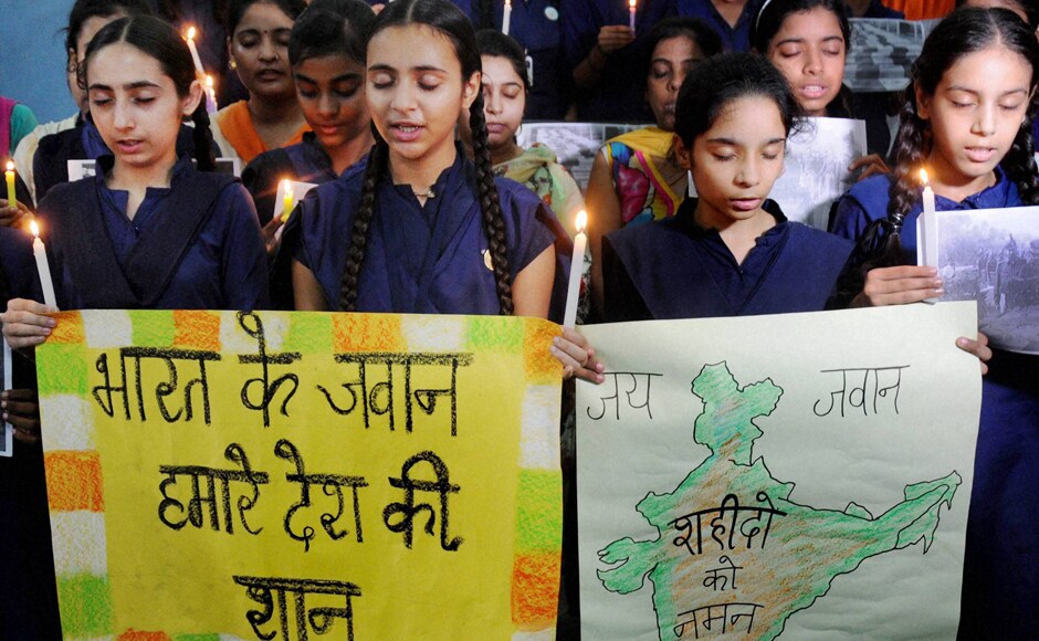 The Indian army honoured the martyrs through gun salutes. Students too joined in by paying tribute to the soldiers through prayers. Photo: PTI The Indian army honoured the martyrs through gun salutes. Students too joined in by paying tribute to the soldiers through prayers. Photo: PTI