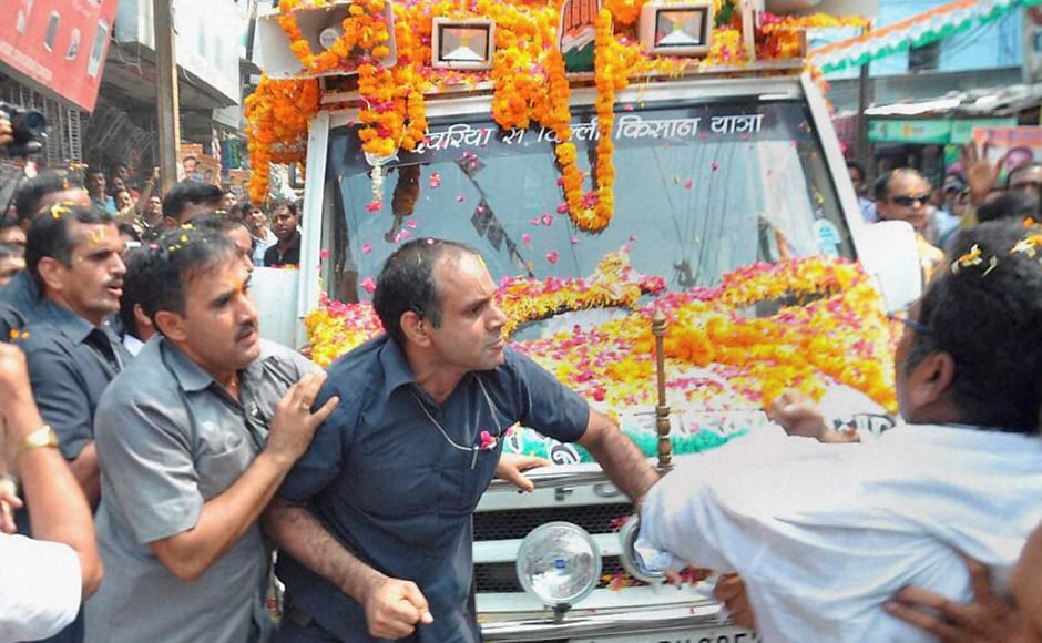 Gandhi had to step in to pacify both the sides. Security was stepped up after a shoe was hurled at him during the roadshow in Sitapur. Photo: PTI Gandhi had to step in to pacify both the sides. Security was stepped up after a shoe was hurled at him during the roadshow in Sitapur. Photo: PTI