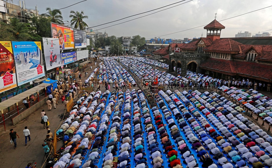 People offer Eid prayers on a street outside a railway station in Mumbai. Additional arrangements were made outside the roads, on pavements and other open areas to accommodate the huge rush. Some places erected special marquees as a precaution against the rains in view of overcast skies. Maharashtra Governor CV Rao and CM Devendra Fadnavis warmly greeted the Muslims on the occasion. (Photo: Reuters) People offer Eid prayers on a street outside a railway station in Mumbai. Additional arrangements were made outside the roads, on pavements and other open areas to accommodate the huge rush. Some places erected special marquees as a precaution against the rains in view of overcast skies. Maharashtra Governor CV Rao and CM Devendra Fadnavis warmly greeted the Muslims on the occasion. (Photo: Reuters)