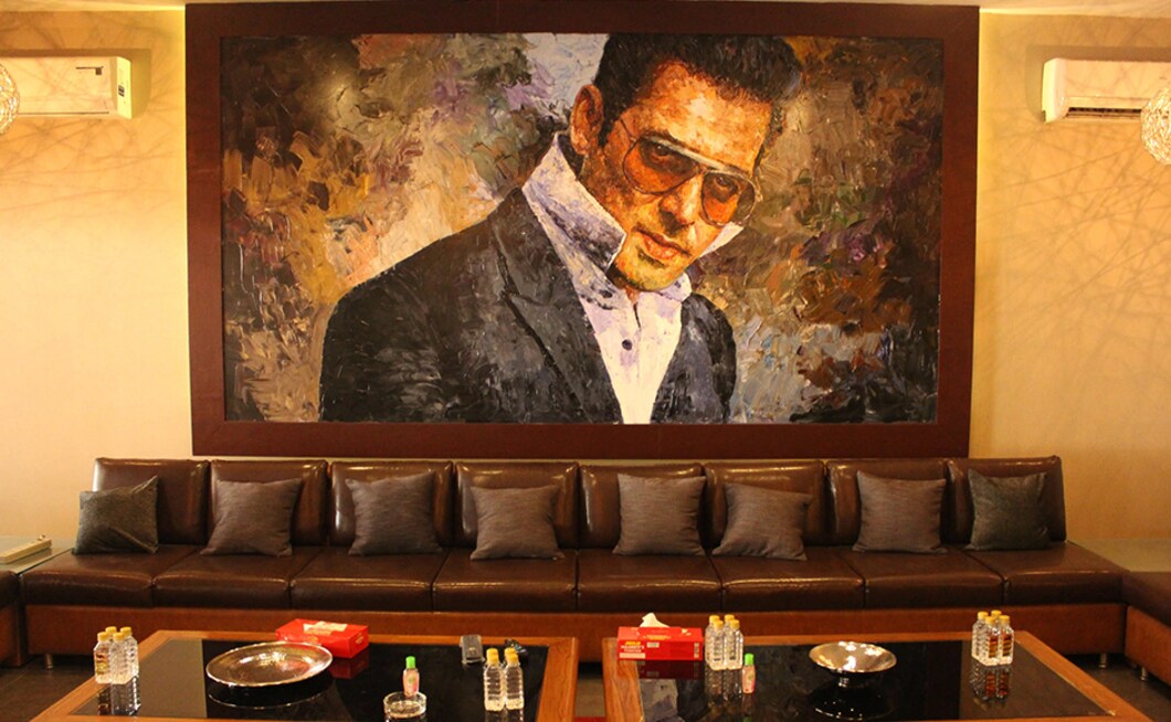 Portraits of Salman Khan in warm tones grace the entire bungalow. The Bigg Boss host is known to be fond off painting so he might be pleased with these personal touches. Firstpost/Seema Sinha Portraits of Salman Khan in warm tones grace the entire bungalow. The Bigg Boss host is known to be fond off painting so he might be pleased with these personal touches. Firstpost/Seema Sinha