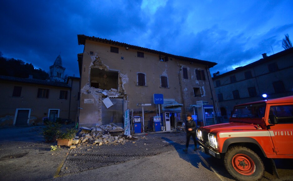 An earthquake with a magnitude of 5.4 hit central Italy on Wednesday, crumbling churches and buildings, knocking out power and sending panicked residents into the rain-drenched streets. AP An earthquake with a magnitude of 5.4 hit central Italy on Wednesday, crumbling churches and buildings, knocking out power and sending panicked residents into the rain-drenched streets. AP