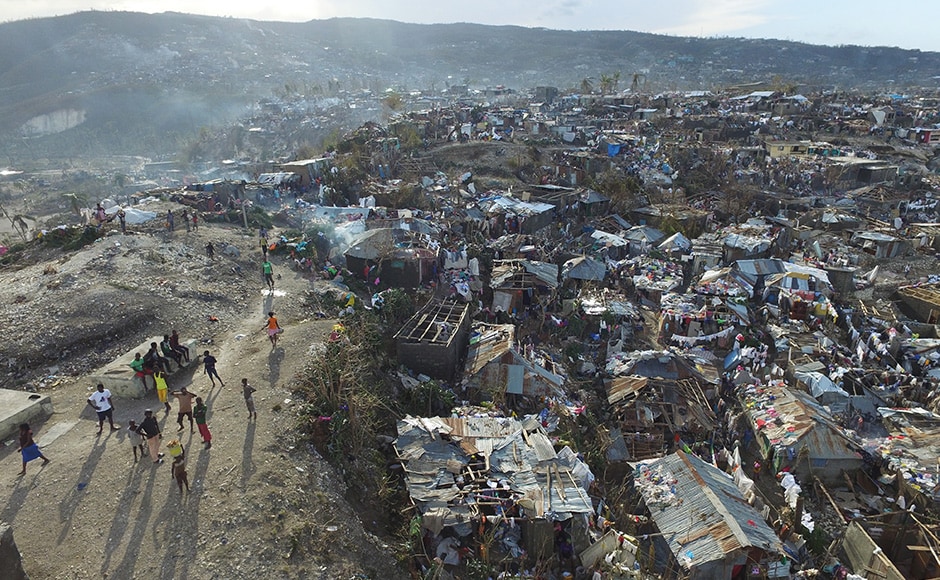 The number of deaths in Haiti, the poorest country in the Americas, surged to 877 on Friday as information trickled in from remote areas previously cut off by the storm. AP The number of deaths in Haiti, the poorest country in the Americas, surged to 877 on Friday as information trickled in from remote areas previously cut off by the storm. AP