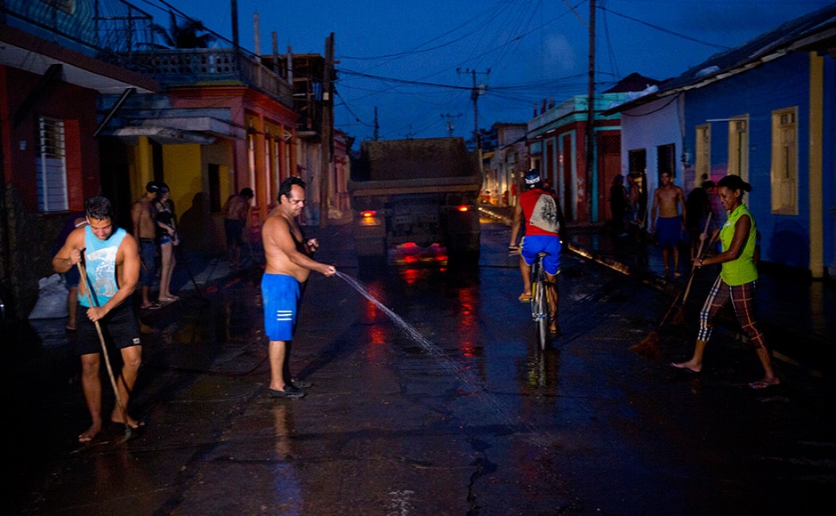 Residents clean a street muddied by the heavy rains brought by Hurricane Matthew in Baracoa, Cuba. Matthew hit Cuba's lightly populated eastern tip Tuesday night, damaging hundreds of homes in the easternmost city of Baracoa but there were no reports of deaths. AP Residents clean a street muddied by the heavy rains brought by Hurricane Matthew in Baracoa, Cuba. Matthew hit Cuba's lightly populated eastern tip Tuesday night, damaging hundreds of homes in the easternmost city of Baracoa but there were no reports of deaths. AP