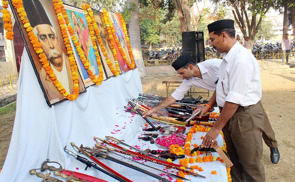 RSS volunteers perform Pujain Nagpur. Dark brown trousers donned by RSS functionaries instead of khaki shorts they had worn for the last 90 years, stood out at the Sangh's foundation day ceremony. PTI RSS volunteers perform Pujain Nagpur. Dark brown trousers donned by RSS functionaries instead of khaki shorts they had worn for the last 90 years, stood out at the Sangh's foundation day ceremony. PTI