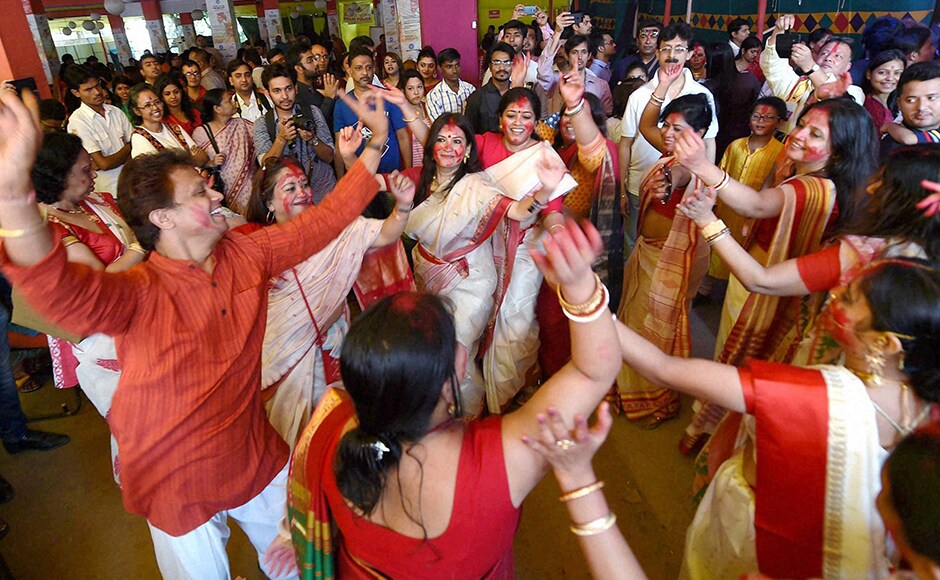 Women participate in Sindur Khela at a puja pandal on the last day of Durga puja at Chittaranjan Park in New Delhi on Tuesday. (Photo: PTI) Women participate in Sindur Khela at a puja pandal on the last day of Durga puja at Chittaranjan Park in New Delhi on Tuesday. (Photo: PTI)